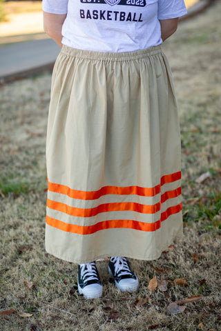 Tan ribbon skirt with orange ribbon