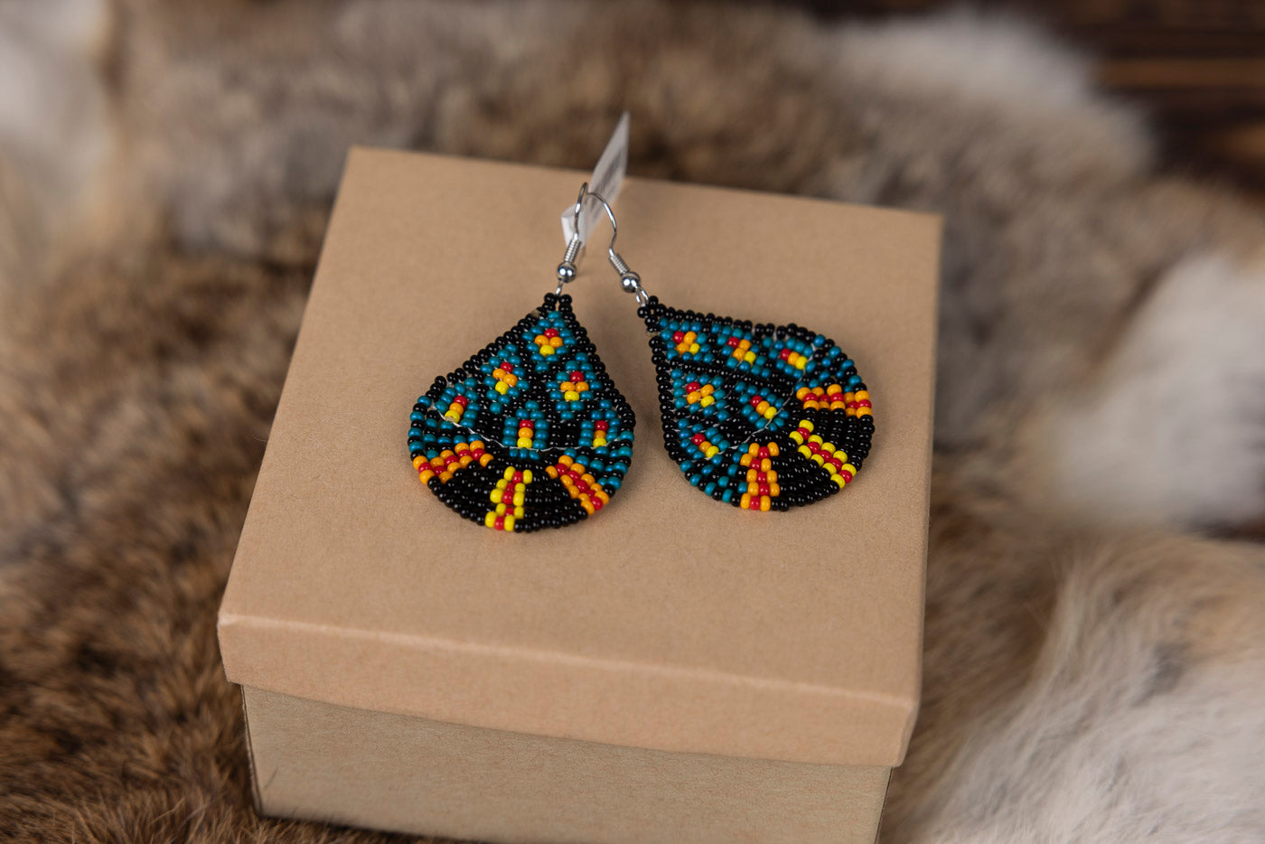 Teardrop Blue Beaded Earrings with Fire Colors