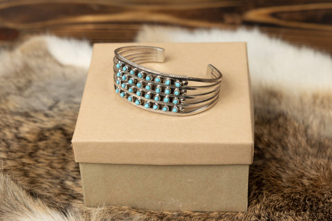 Lot - An Effie Calavaza Zuni turquoise and silver cuff bracelet